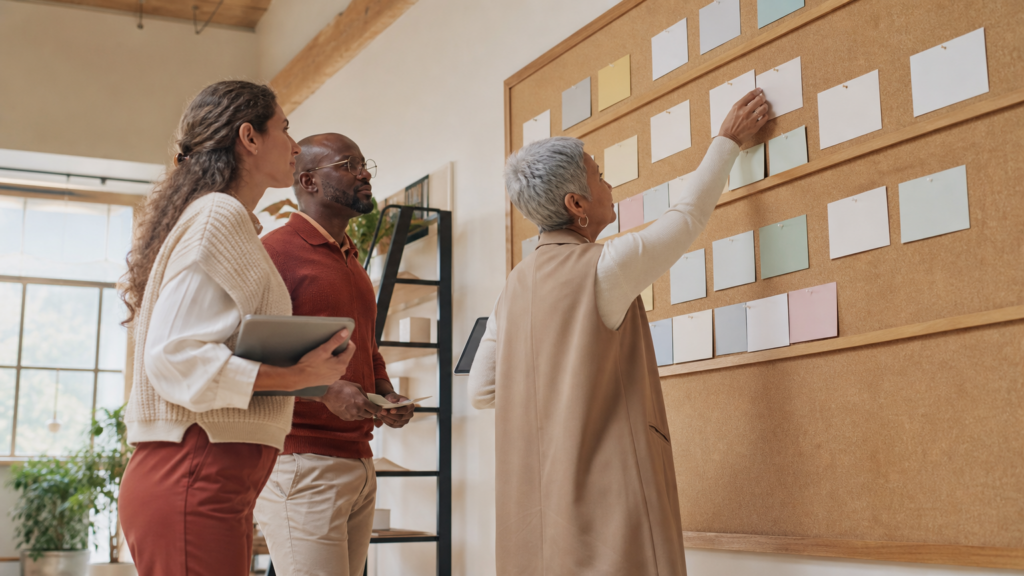 An adult volunteer organizing an abstract data catalog and governance checklist without readable names, records, or private information.